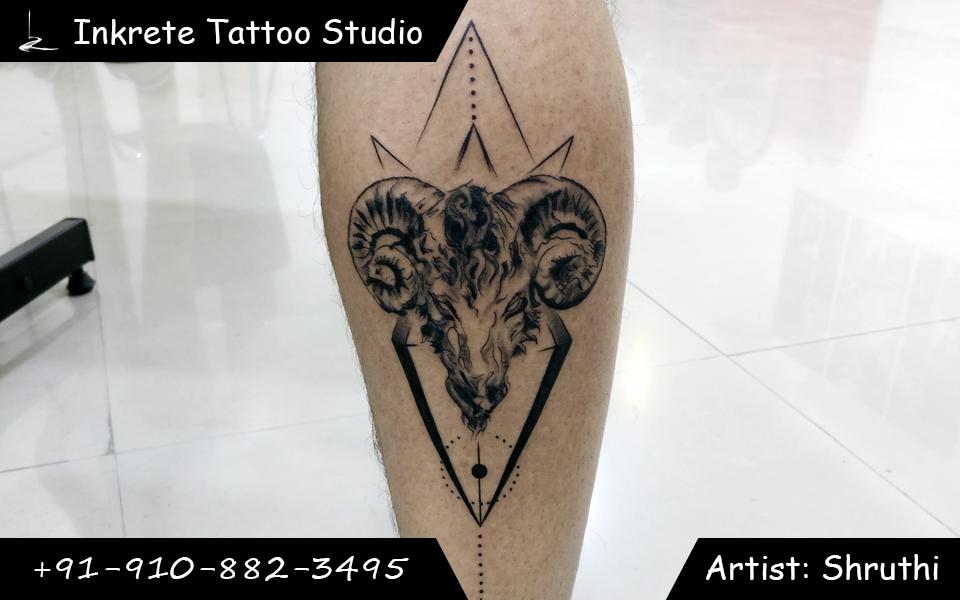 ram tattoo, zodiac sign tattoo ideas, calf tattoo ideas, black and grey tattoo