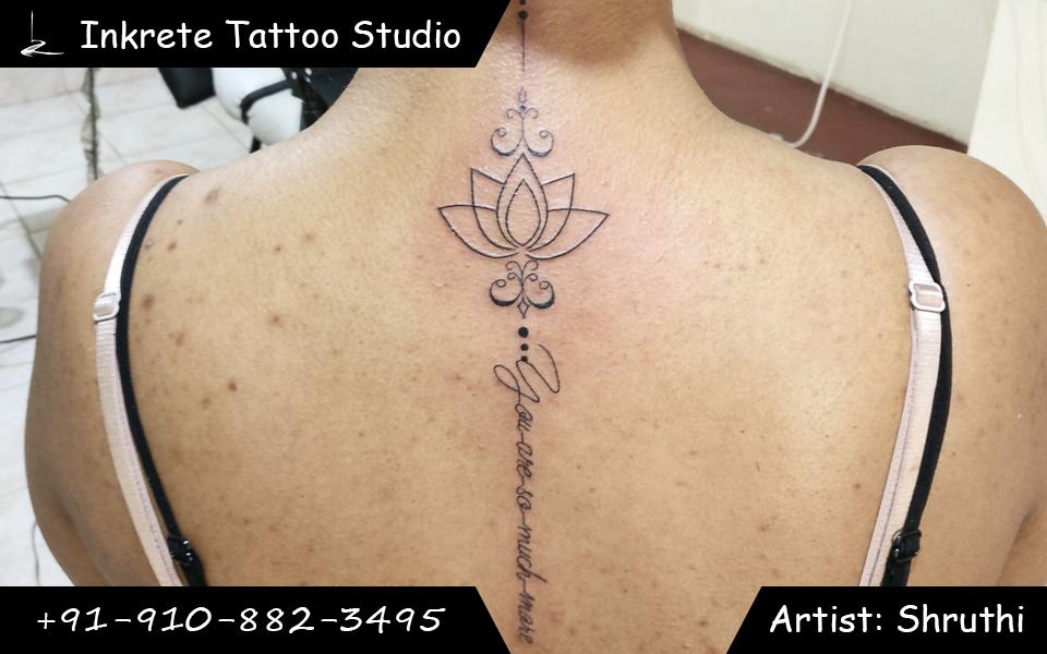 Spine tattoo, lotus with phrase  tattoo, minimal lotus tattoo