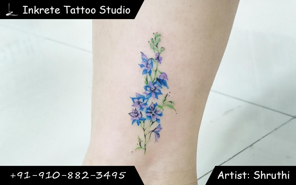 blue flower tattoo, purple flower tattoo, birth flower tattoo, best tattoo studio, best tattoo artist, floral tattoo, tattoo ideas, colour tattoo