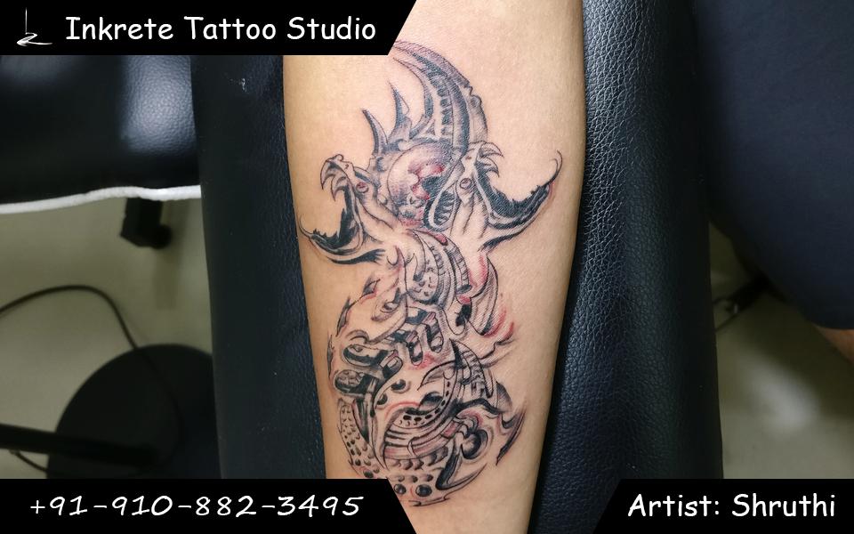 Dragon tattoo, third eye tattoo, bio mechanical tattoo