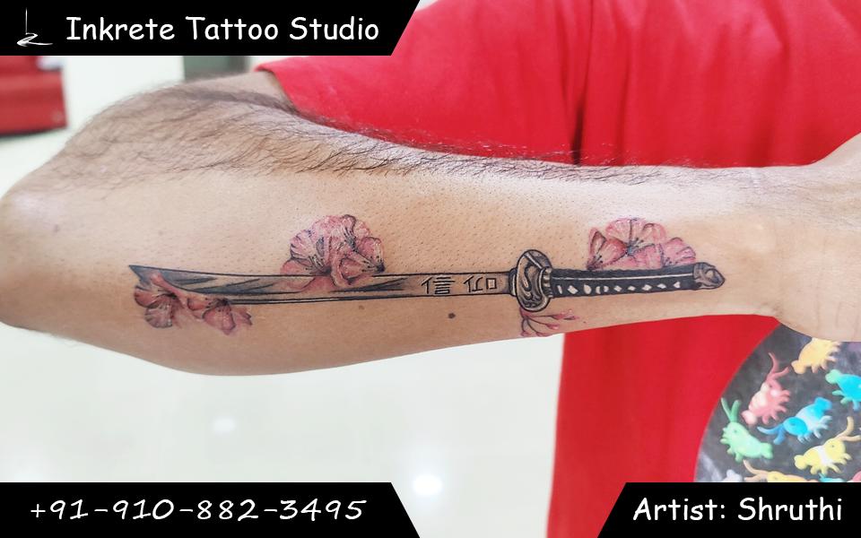 katana tattoo, japanese tattoo, sword tattoo, color tattoo, cherry blossoms tattoo